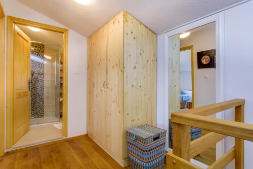 a room with a staircase and a walk in shower at Holiday home Verin in Mali Lošinj