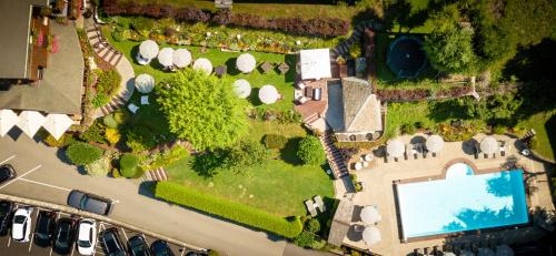 an aerial view of a mansion with a swimming pool at Hotel & Spa Le Dahu in Morzine