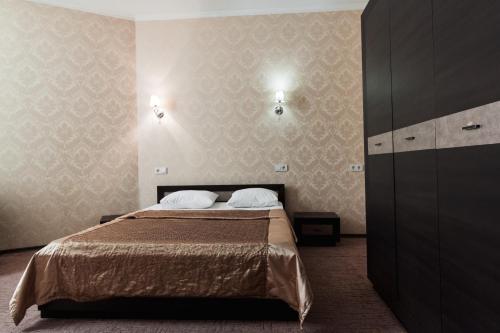 Postel nebo postele na pokoji v ubytování Noy Hotel