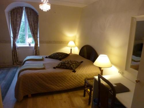 Postel nebo postele na pokoji v ubytování Nya Pallas Hotel