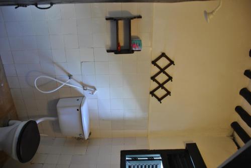 a bathroom with a urinal and a toilet at Shella White House in Lamu