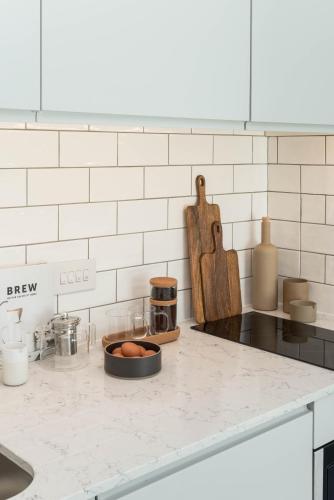 a kitchen counter with a bowl of eggs on it at ARK Canary Wharf in London