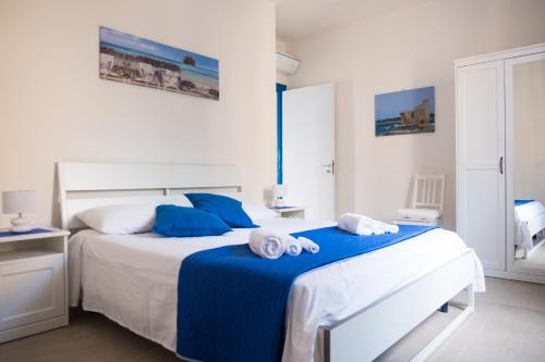 Postel nebo postele na pokoji v ubytování Finestra Sul Mare