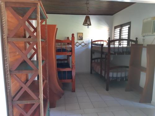 a room with two bunk beds in a room at PARAISO NAS ÁGUAS in Barra de São Miguel