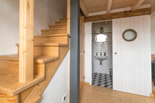 a renovation of a house with a staircase and a bathroom at Bohemian Antique Guesthouse in Odeceixe