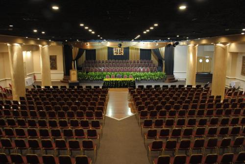 an empty auditorium with chairs and a stage at Nobile Suites Excelsior Asuncion in Asuncion