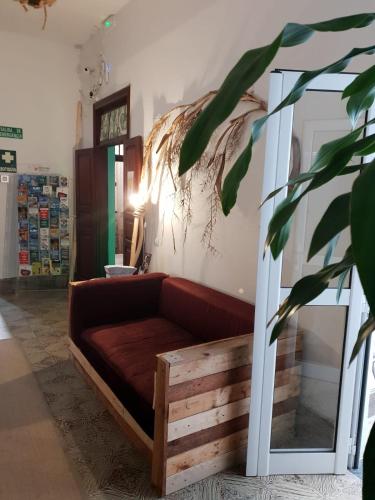 a living room with a couch and a mirror at Cactus Host in Las Palmas de Gran Canaria