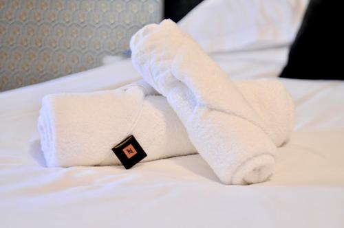 Ένα ή περισσότερα κρεβάτια σε δωμάτιο στο Appart Hotel NuitéeJour Le Mans Centre Jaurès