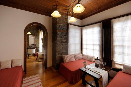 a living room with a couch and a table at Marelia Hotel in Poligiros