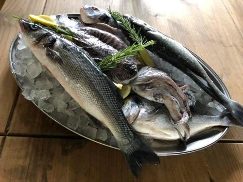 a plate of fish sitting on a table at Michelangelos - Rooms, Restaurant & Bar in Gateshead