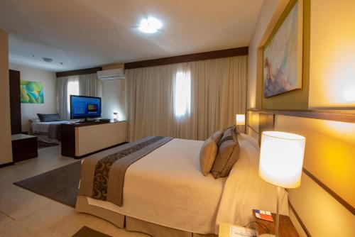 TV a/nebo společenská místnost v ubytování Mondrian Suite Hotel