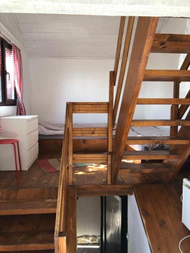 a staircase in a room with a bunk bed at Александрова вила 1 in Zlatograd