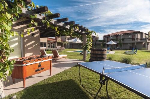
a kitchen with a tennis court and a tennis racquet at Villa Mansa in Vistalba

