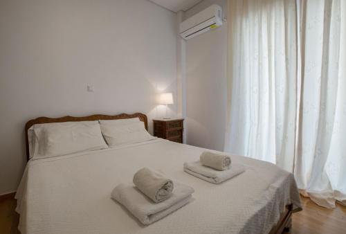 Ένα ή περισσότερα κρεβάτια σε δωμάτιο στο Edem BeachFront SeaView Dream Home In Beautiful Athens Riviera in Palaio Faliro