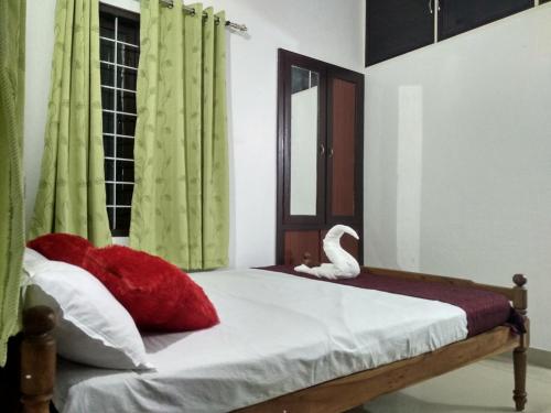 Ένα ή περισσότερα κρεβάτια σε δωμάτιο στο Blue Birds Homestay