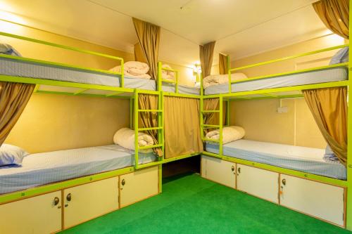 a room with bunk beds in a hostel at Big Tree Hostel in Kathmandu