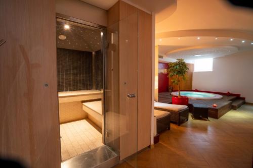 a room with a swimming pool and a living room at Covo dei Saraceni in Polignano a Mare
