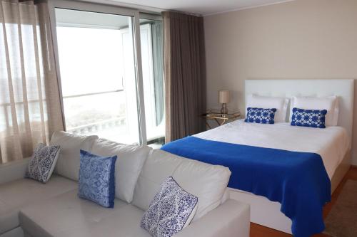 Ένα ή περισσότερα κρεβάτια σε δωμάτιο στο Bartolomeu Beach Apartments