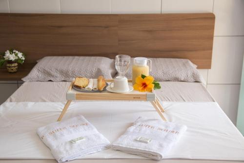Cama ou camas em um quarto em Suítes Soure