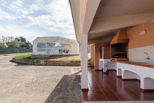 a view of a building with a glass house at Quinta do Paraíso in Palmela