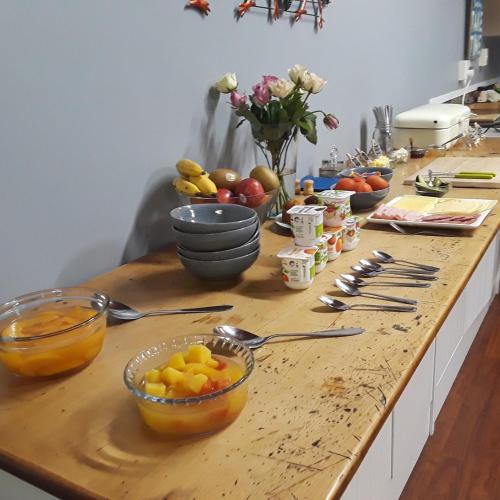 a kitchen counter with bowls of fruit on it at Lady Bowen Bed & Breakfast in Thames