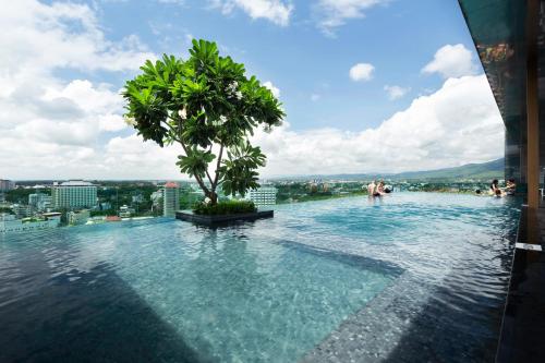 a infinity pool on the floor of a building at Anta Residence ''Self-sevice apartment'' in Chiang Mai