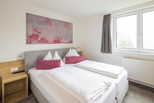 Postel nebo postele na pokoji v ubytování Sunshine Appartements Schilchegger