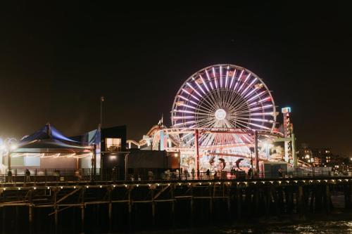 a ferris wheel on a pier at night at 8th and Ardmore in Los Angeles