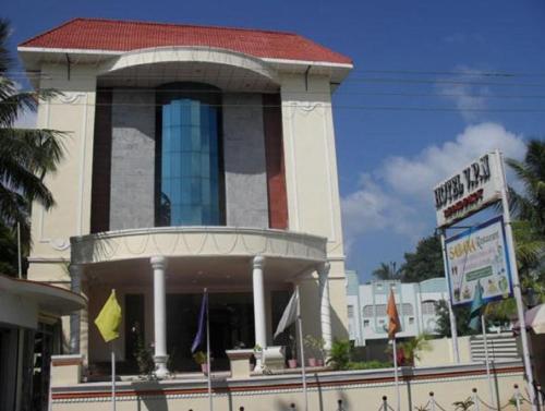 a building with a sign in front of it at Hotel Vpn Residency in Velānganni