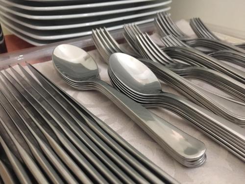 a group of silver utensils sitting on a table at Casa Mafalda B&B in Lipari