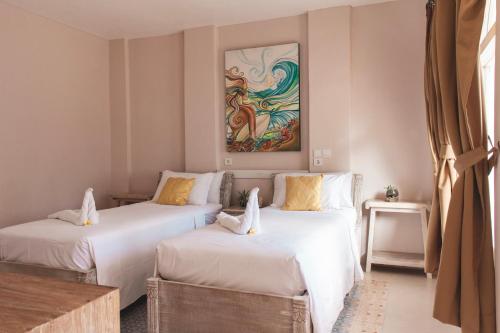 Voodi või voodid majutusasutuse ISLA INDAH RETREAT boutique hotel toas