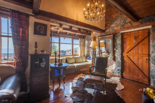 a living room with a couch and a chair at Villa Palaios Agios Athanasios in Palaios Agios Athanasios