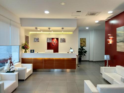 a lobby of a clinic with a reception desk at Mena Plaza in Nerja
