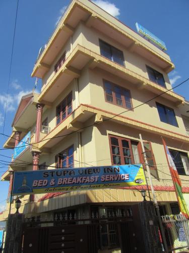 a building with a sign in front of it at STUPA VIEW INN in Kathmandu