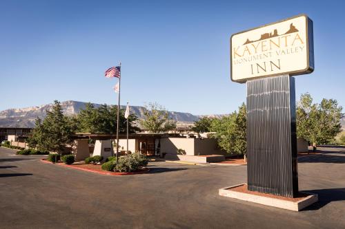 a sign for a hyundai maintenance village inn in a parking lot at Kayenta Monument Valley Inn in Kayenta