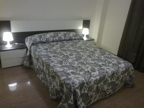 Postel nebo postele na pokoji v ubytování VFT LA PAZ