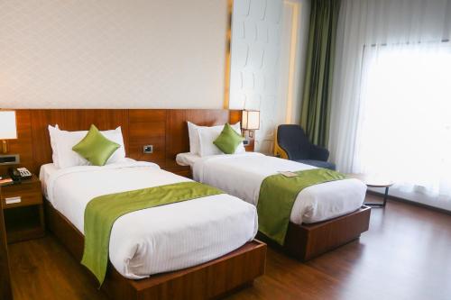 Postel nebo postele na pokoji v ubytování HOTEL CEASAR PALACE