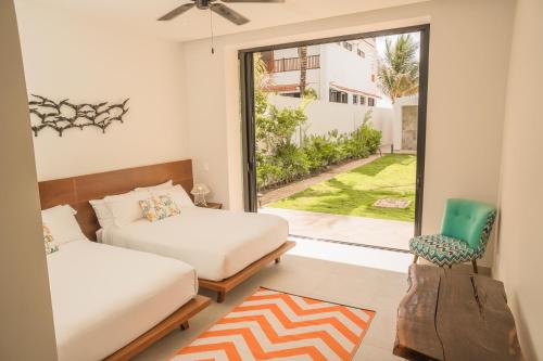 Katil atau katil-katil dalam bilik di ApartHotel Ebb Ti Kaan Tulum-Luxury Condos-