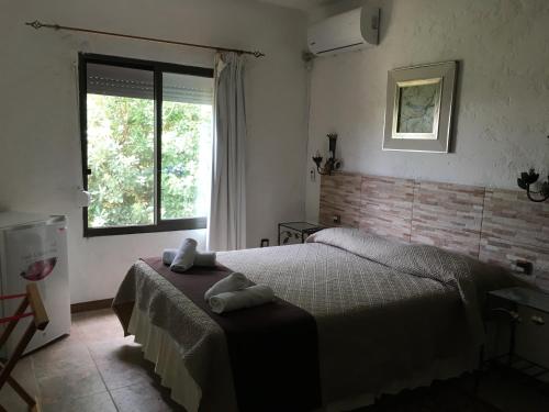 Ένα ή περισσότερα κρεβάτια σε δωμάτιο στο Hotel de la Torre