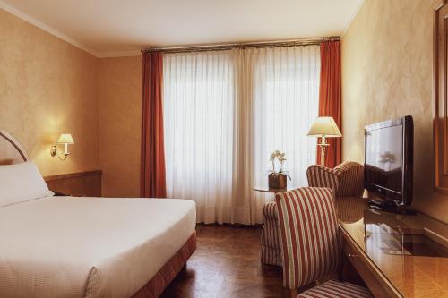TV a/nebo společenská místnost v ubytování Agora' Palace Hotel