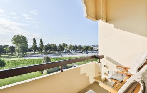 a balcony with a view of a park at Villa am Meer in Grömitz