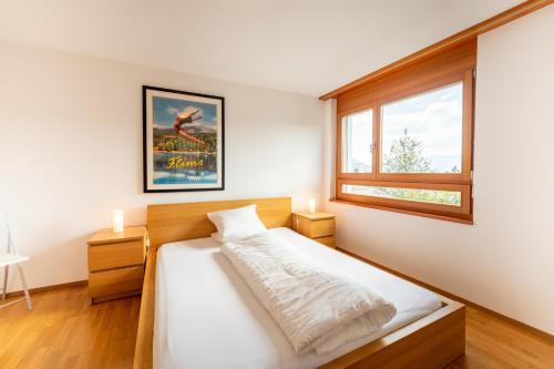 Postel nebo postele na pokoji v ubytování LAAX Homes - Casa Miro Nr 6