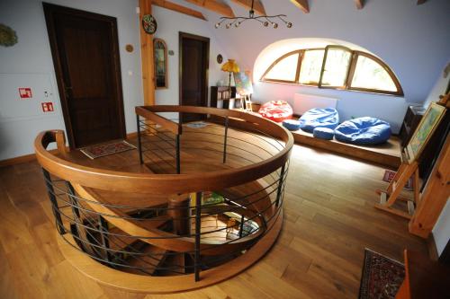 a living room with a wooden floor and a round table at Ekosamotnia in Kraków