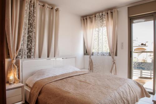 a bedroom with a bed and a window at villa Debora with heated pool in Eilat