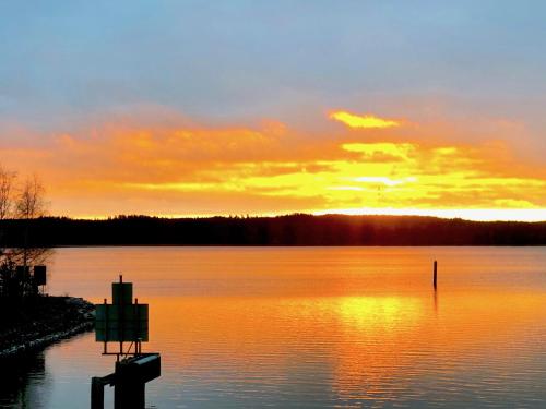 a sunset over a large body of water at Villa Ekbladh in Västanfjärd