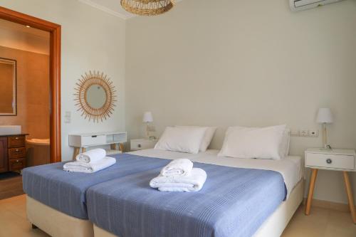 Ένα ή περισσότερα κρεβάτια σε δωμάτιο στο ANGIO VILLAS SPA