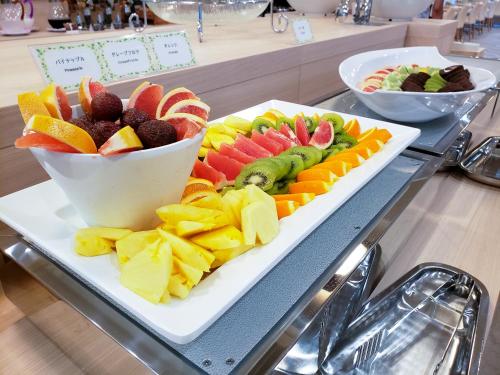 a tray of fruits and vegetables on a table at Hotel Lantana Naha Kokusai-Dori in Naha