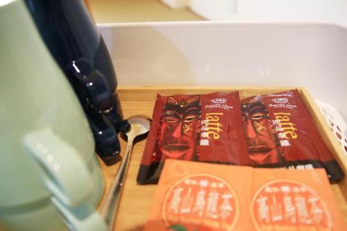 a box of chocolate chips sitting on top of a table at The Wind BnB Ⅱ in Budai