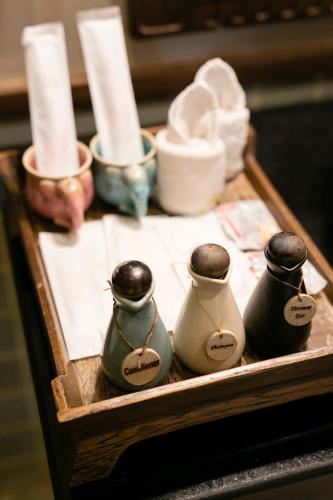 a wooden tray with three differentiatesiatesiatesiatesiatesiatesktop at Amata Lanna Chiang Mai, One Member of the Secret Retreats in Chiang Mai