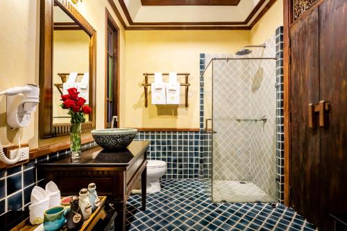 a bathroom with a sink and a toilet and a shower at Amata Lanna Chiang Mai, One Member of the Secret Retreats in Chiang Mai